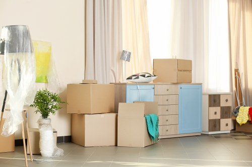 Removal van and moving crew planning a house move in Merton