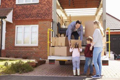 Professional movers handling furniture and household items