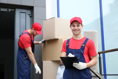 Furniture pick-up service preparing to remove bulky items from a Merton home