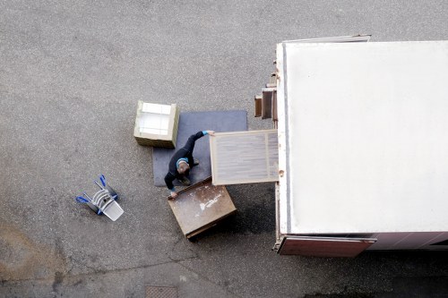 Packed moving boxes and furniture ready for a house removal in Merton