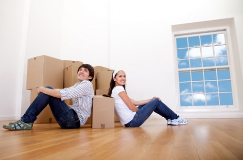 Commercial movers handling office furniture and equipment during a local Merton relocation
